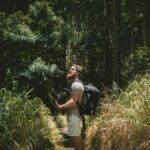 Person spending time in nature through outdoor experiences and active lifestyle