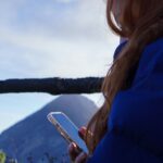 Person disconnecting from screens and reconnecting with outdoor experiences through an active lifestyle